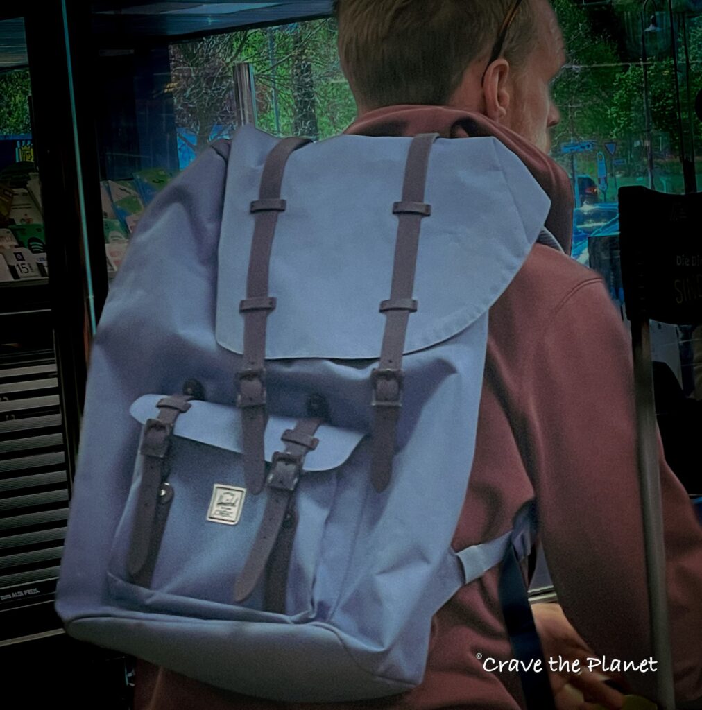 a man wearing a herschel backpack
