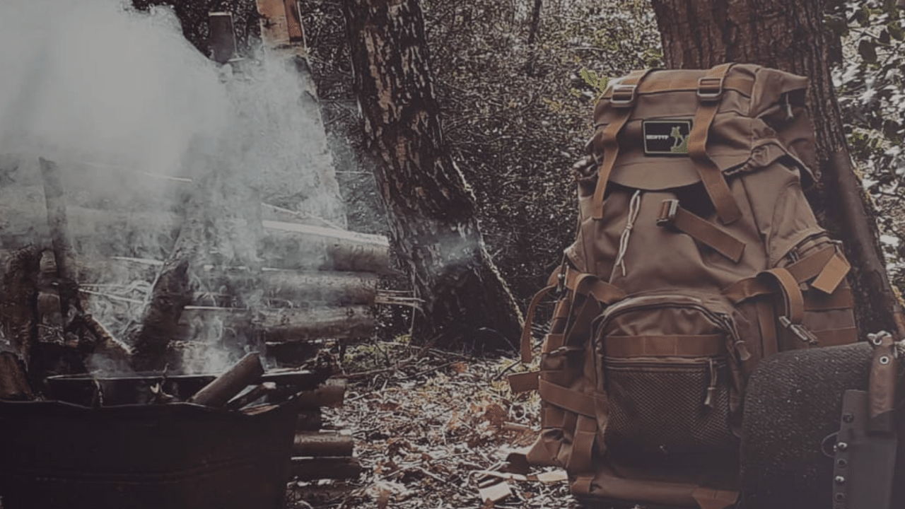 rucking backpack on ground by fire