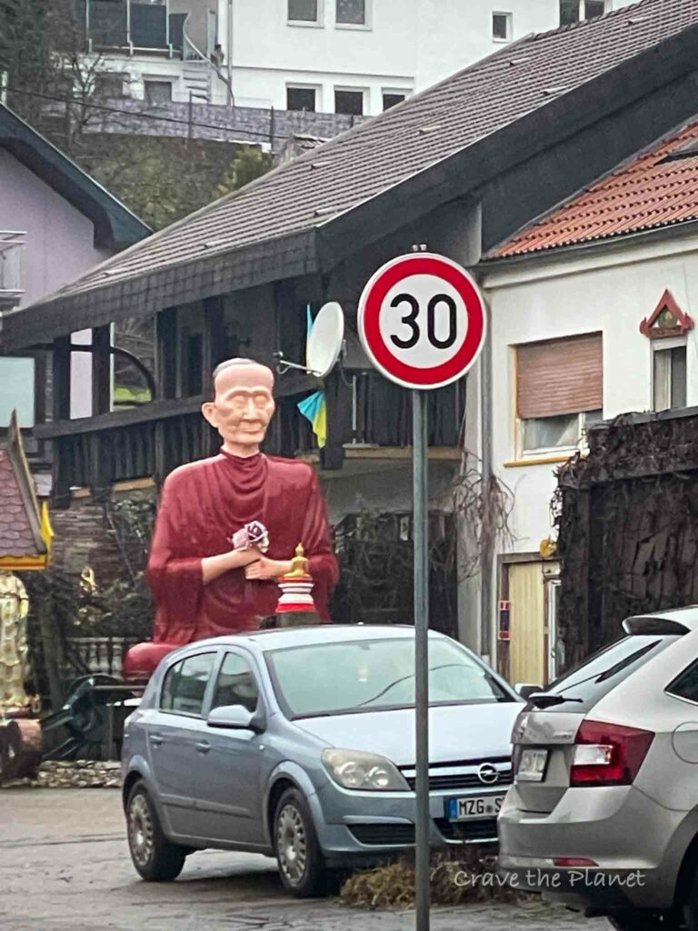 weird village in german with man statue