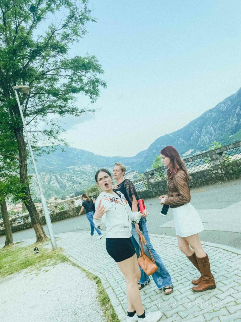 2 teenagers walking along coast in montenegro
